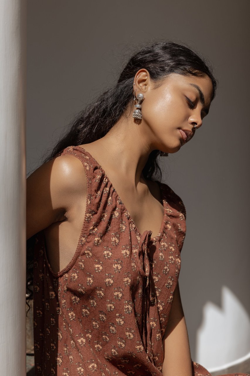 Sundress Mini Almond — model seated or relaxed, casual portrait showing mini length, almond cotton hand block print sundress, sustainable slow fashion India | Daughters of India