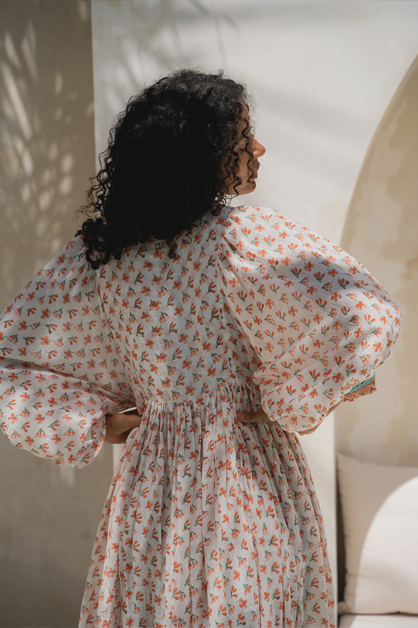 Daughters of India Kyra Maxi Dress in Coral — back close-up showing gathered waist and billowed sleeve, coral block print