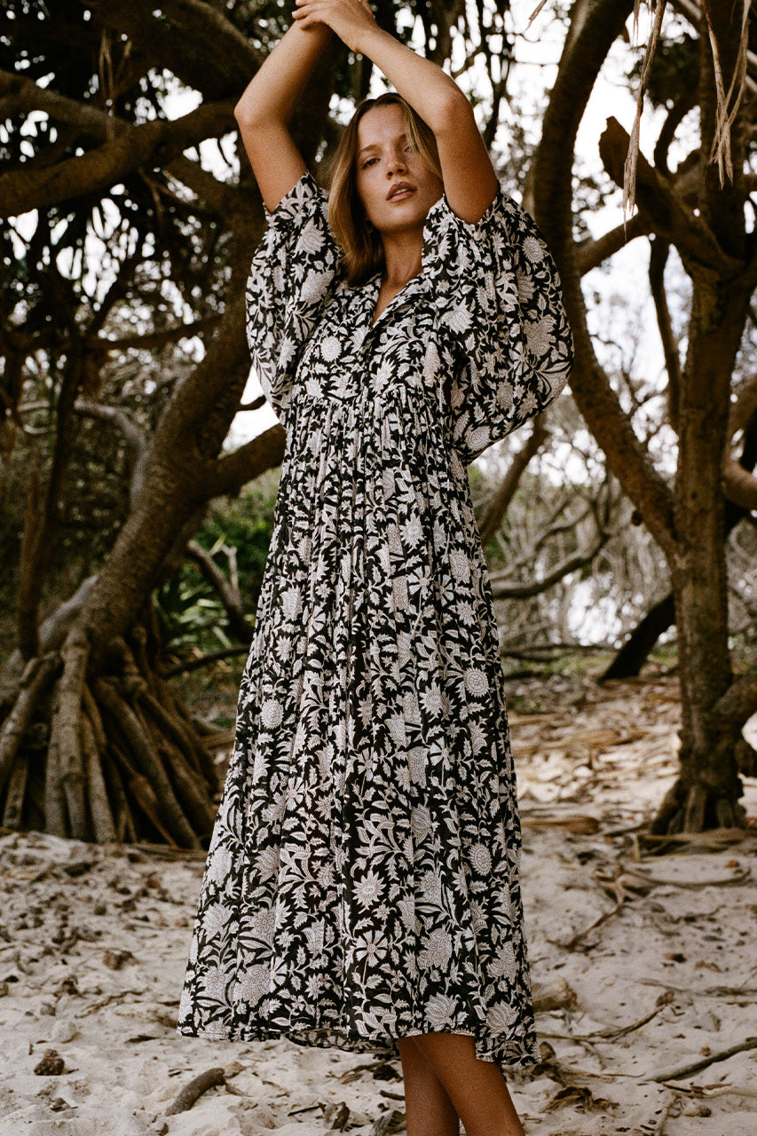 Daughters of India Kyra Midi Dress in Pepper — side view by twisted mangrove tree, cotton