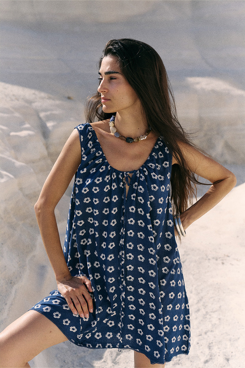 Sundress Mini Indigo — hand block print indigo mini dress with daisy print on sandy beach | Daughters of India